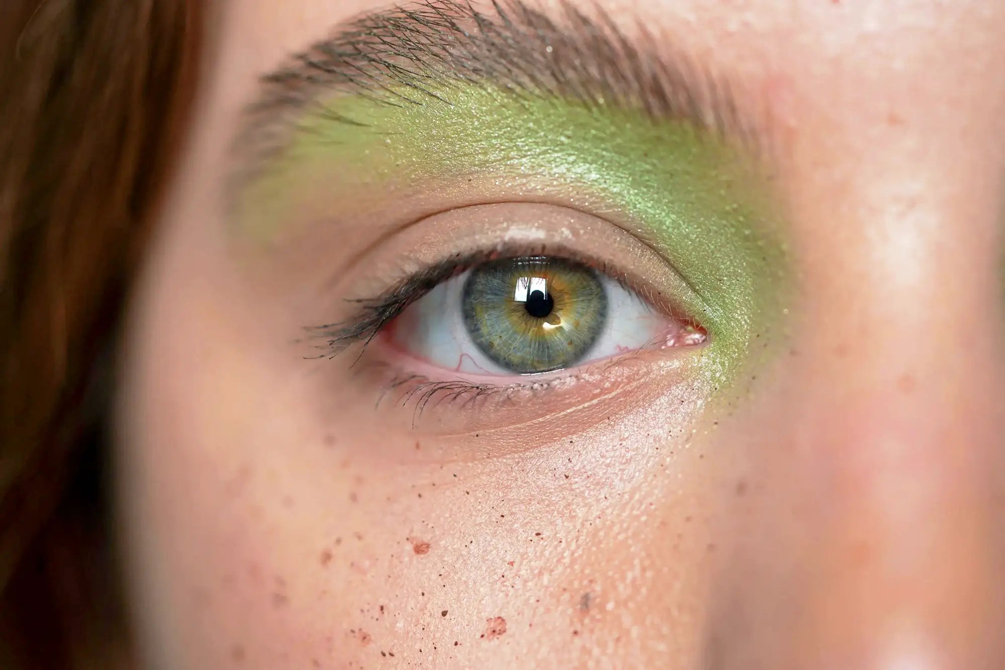 Close-up of a person's eye with green eyeshadow Shot on Samsung Galaxy S24 + APEXEL ZoomMacro